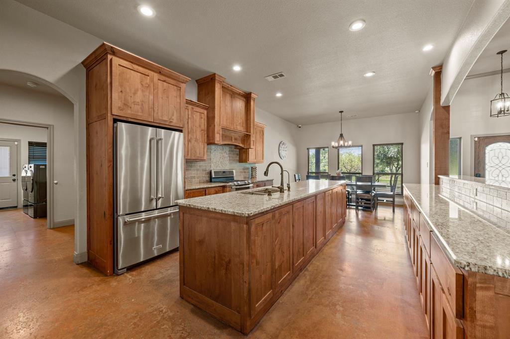 3019 Fm 718 Newark, TX 76071 - Photo 10 of 40 a kitchen with stainless steel appliances granite countertop a refrigerator a sink a stove and a refrigerator