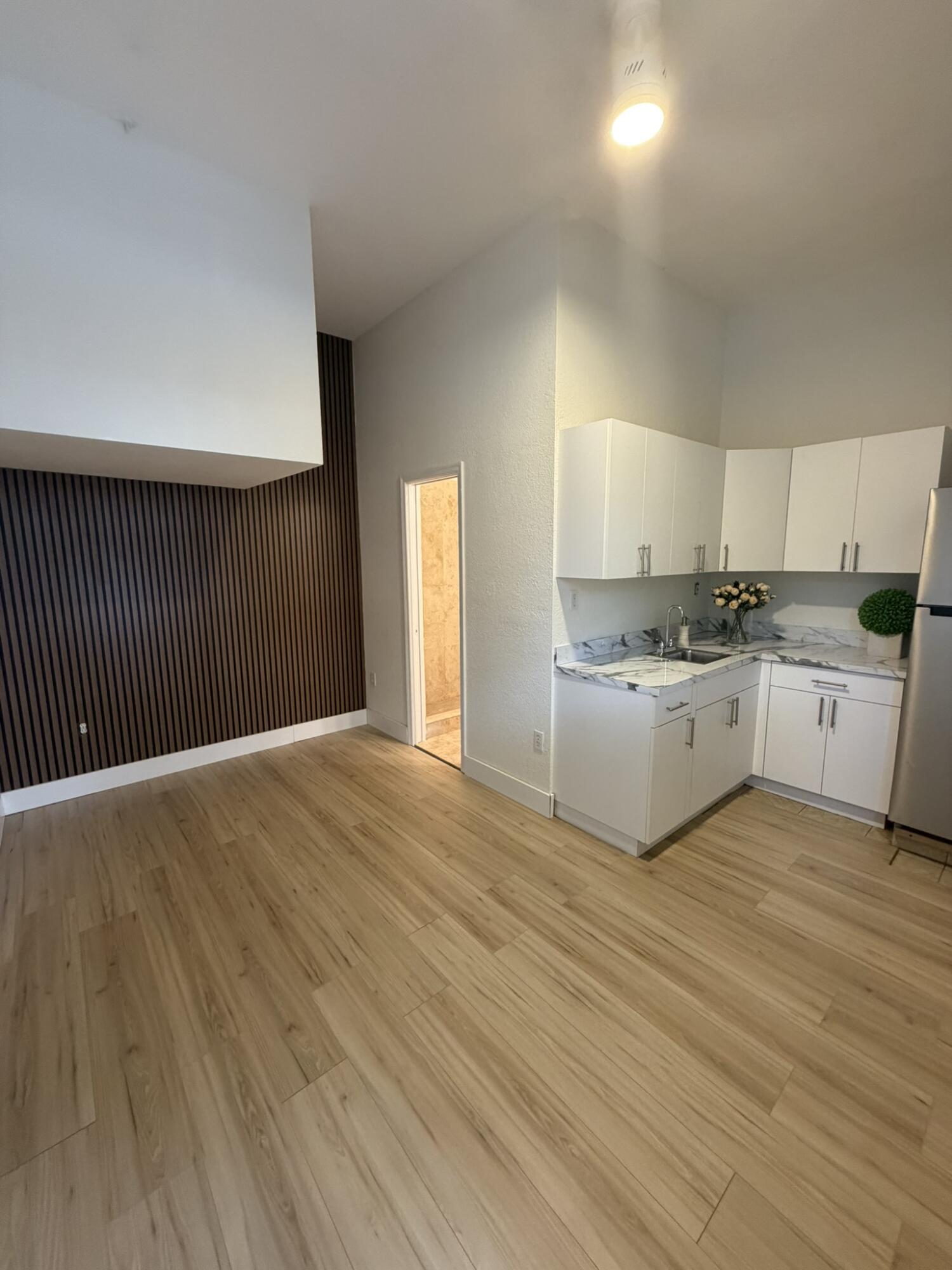 17296 Northwest 88th Court, Unit STUDIO Hialeah, FL 33018 - Photo 1 of 12 a kitchen with stainless steel appliances granite countertop a stove a sink and white cabinets