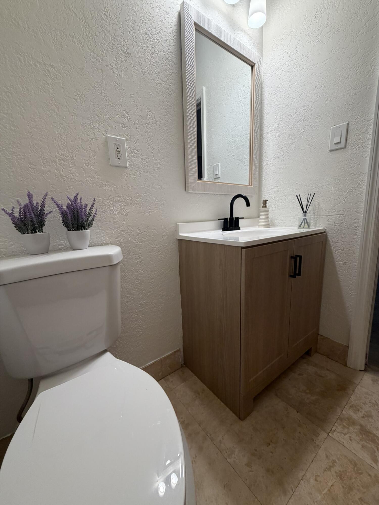 17296 Northwest 88th Court, Unit STUDIO Hialeah, FL 33018 - Photo 5 of 12 a bathroom with a sink and a toilet