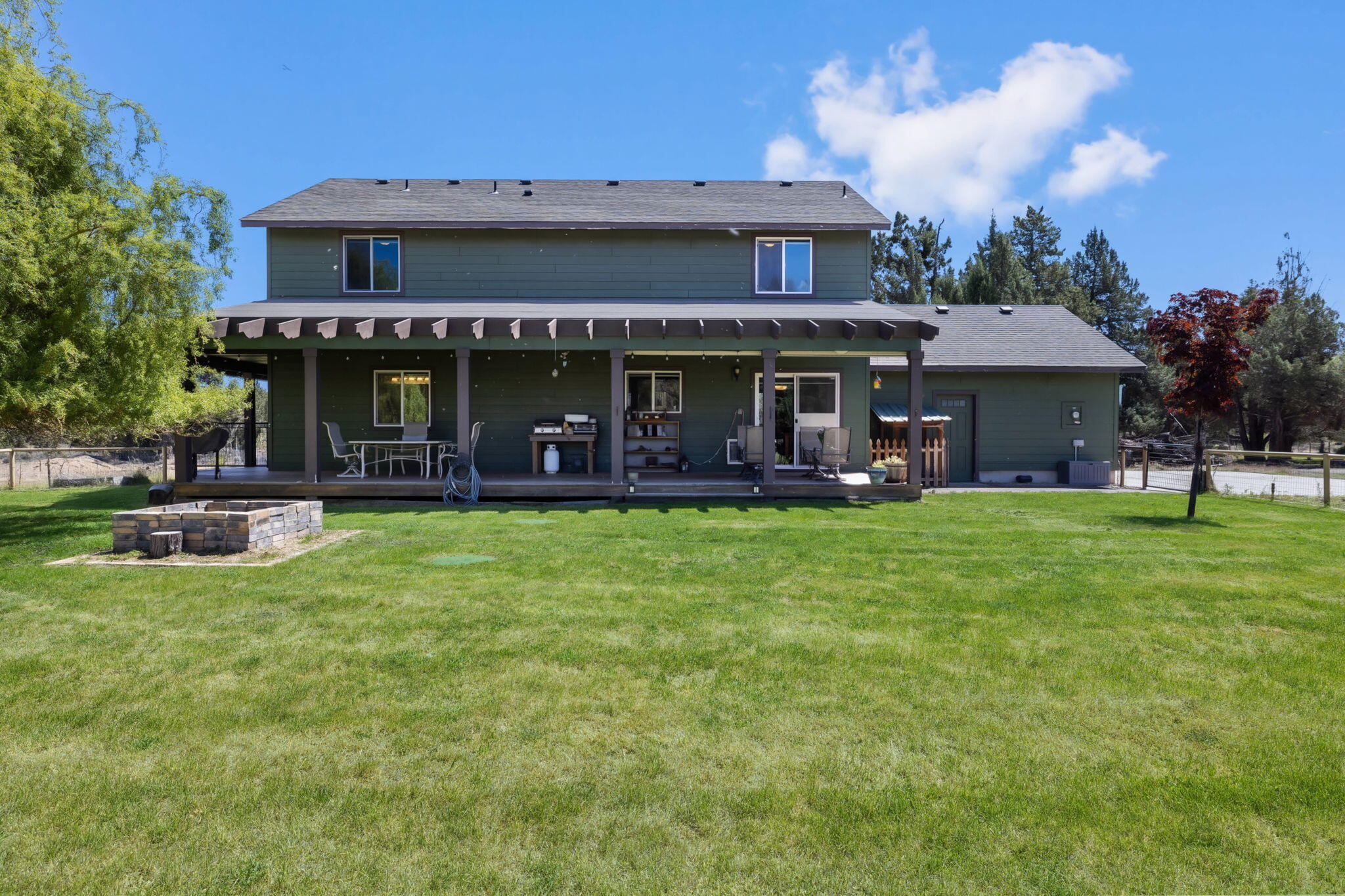 63639 Gentry Loop Bend, OR 97701 - Photo 33 of 40 a view of a house with a yard porch and sitting area