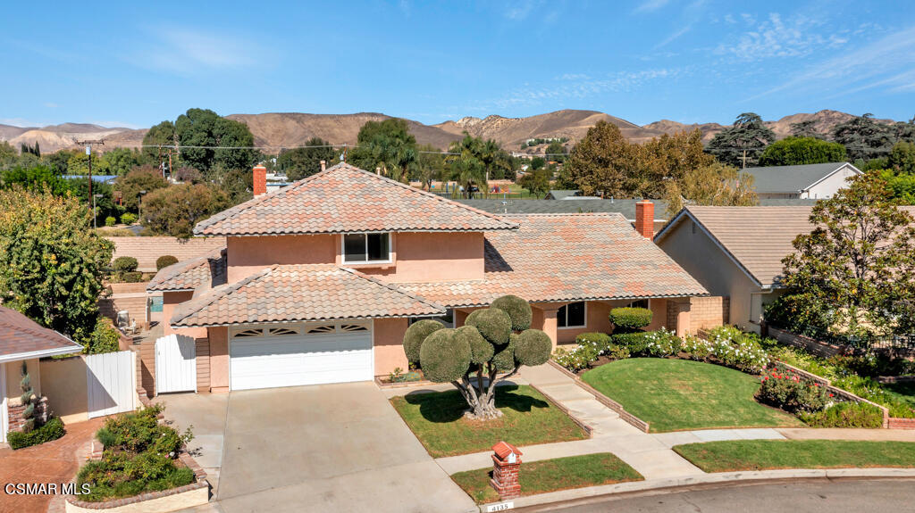 4135 Springfield Street Simi Valley, CA 93063 - Photo 1 of 41 a front view of a house with a garden