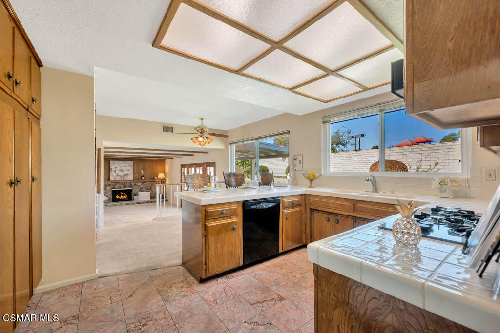 4135 Springfield Street Simi Valley, CA 93063 - Photo 4 of 41 a kitchen with stainless steel appliances granite countertop a sink stove and cabinets