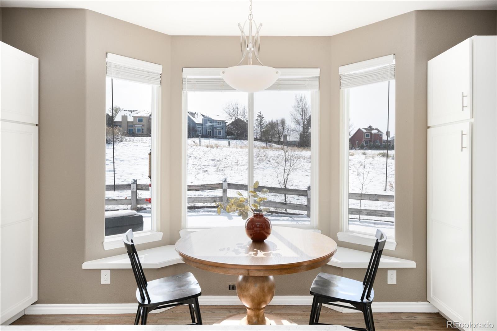 9486 South Autumn Ash Place Highlands Ranch, CO 80126 - Photo 16 of 50 a dining room with furniture and window