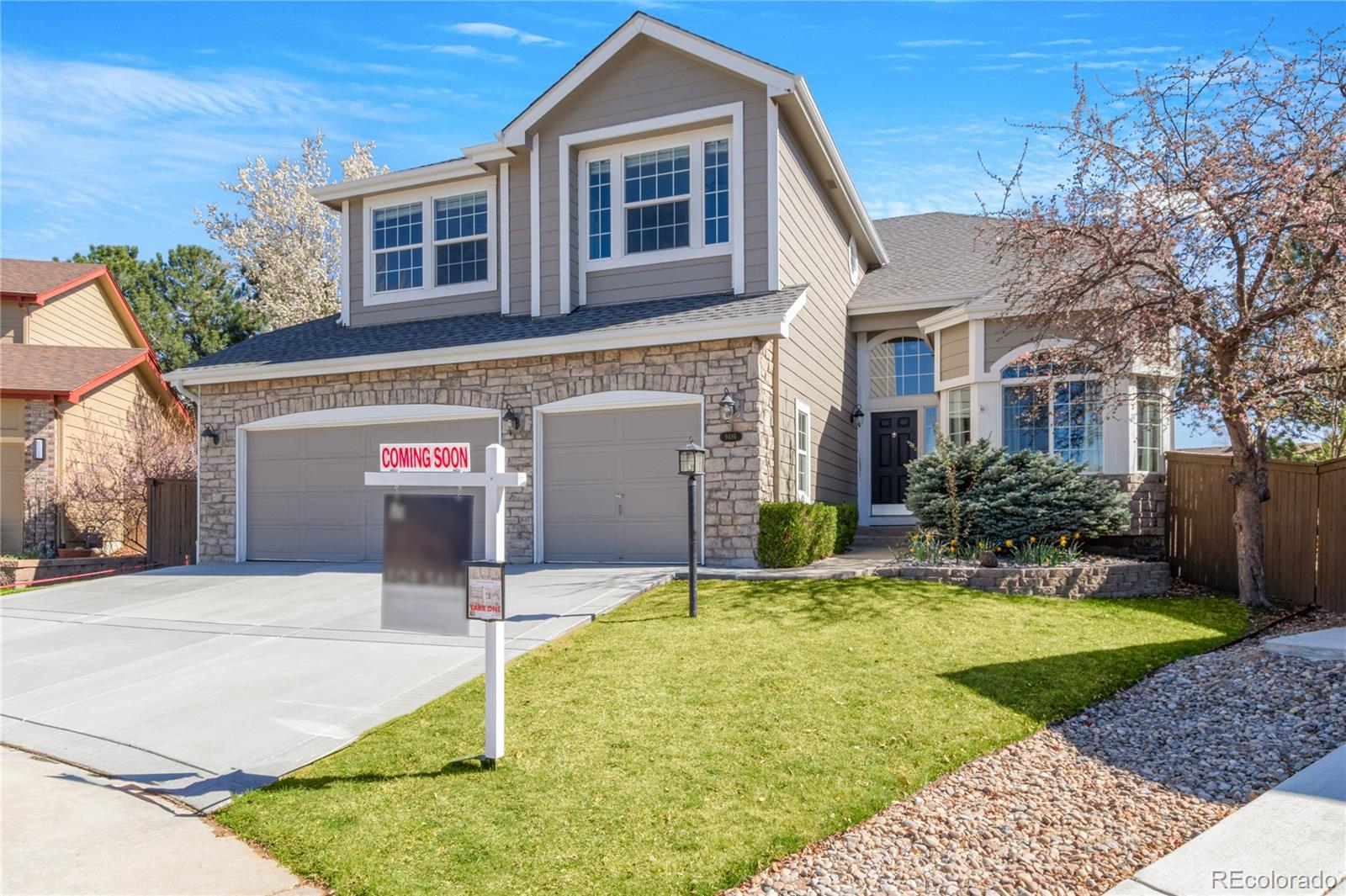 9486 South Autumn Ash Place Highlands Ranch, CO 80126 - Photo 2 of 50 a front view of a house with a yard
