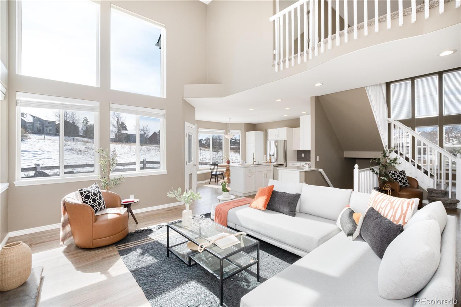 9486 South Autumn Ash Place Highlands Ranch, CO 80126 - Photo 23 of 50 a living room with furniture and a large window