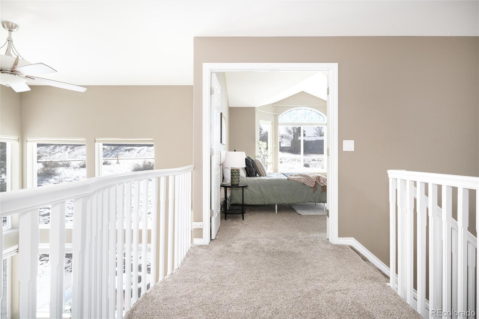 9486 South Autumn Ash Place Highlands Ranch, CO 80126 - Photo 26 of 50 a view of a bedroom from a hallway