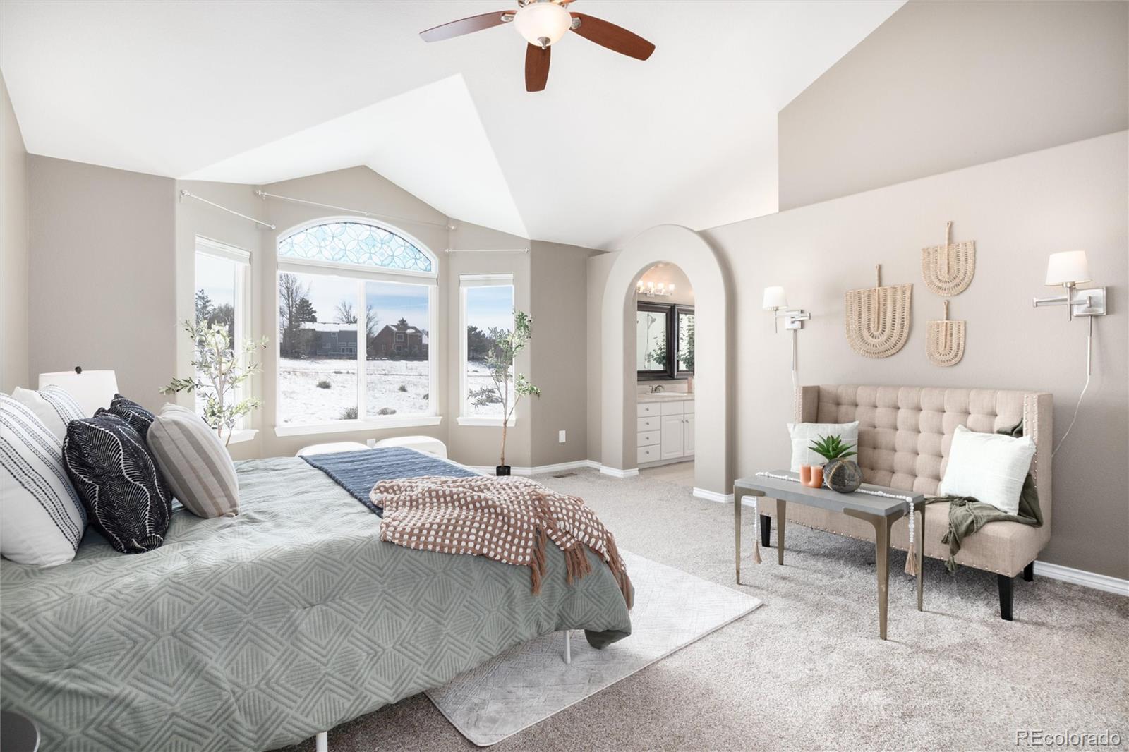 9486 South Autumn Ash Place Highlands Ranch, CO 80126 - Photo 27 of 50 a bedroom with bed and a large window