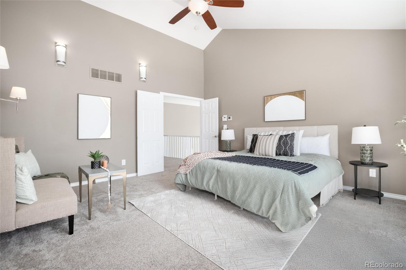 9486 South Autumn Ash Place Highlands Ranch, CO 80126 - Photo 29 of 50 a bedroom with a bed and a chandelier