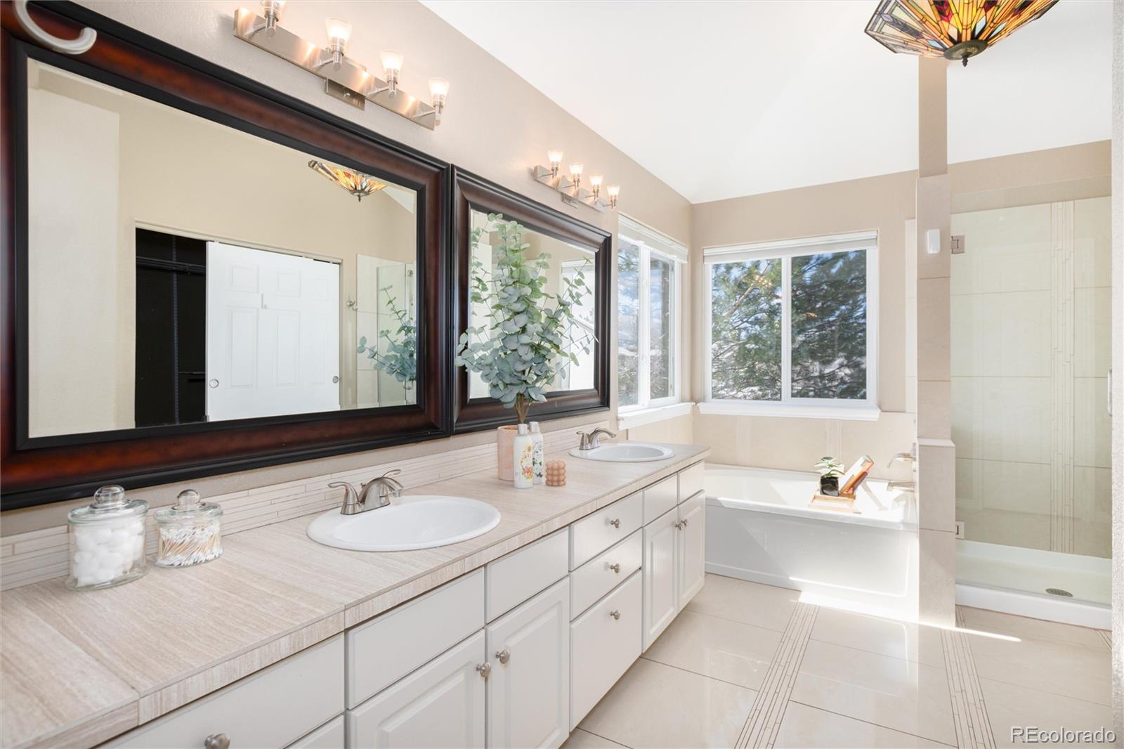 9486 South Autumn Ash Place Highlands Ranch, CO 80126 - Photo 31 of 50 a bathroom with a sink double vanity and a mirror