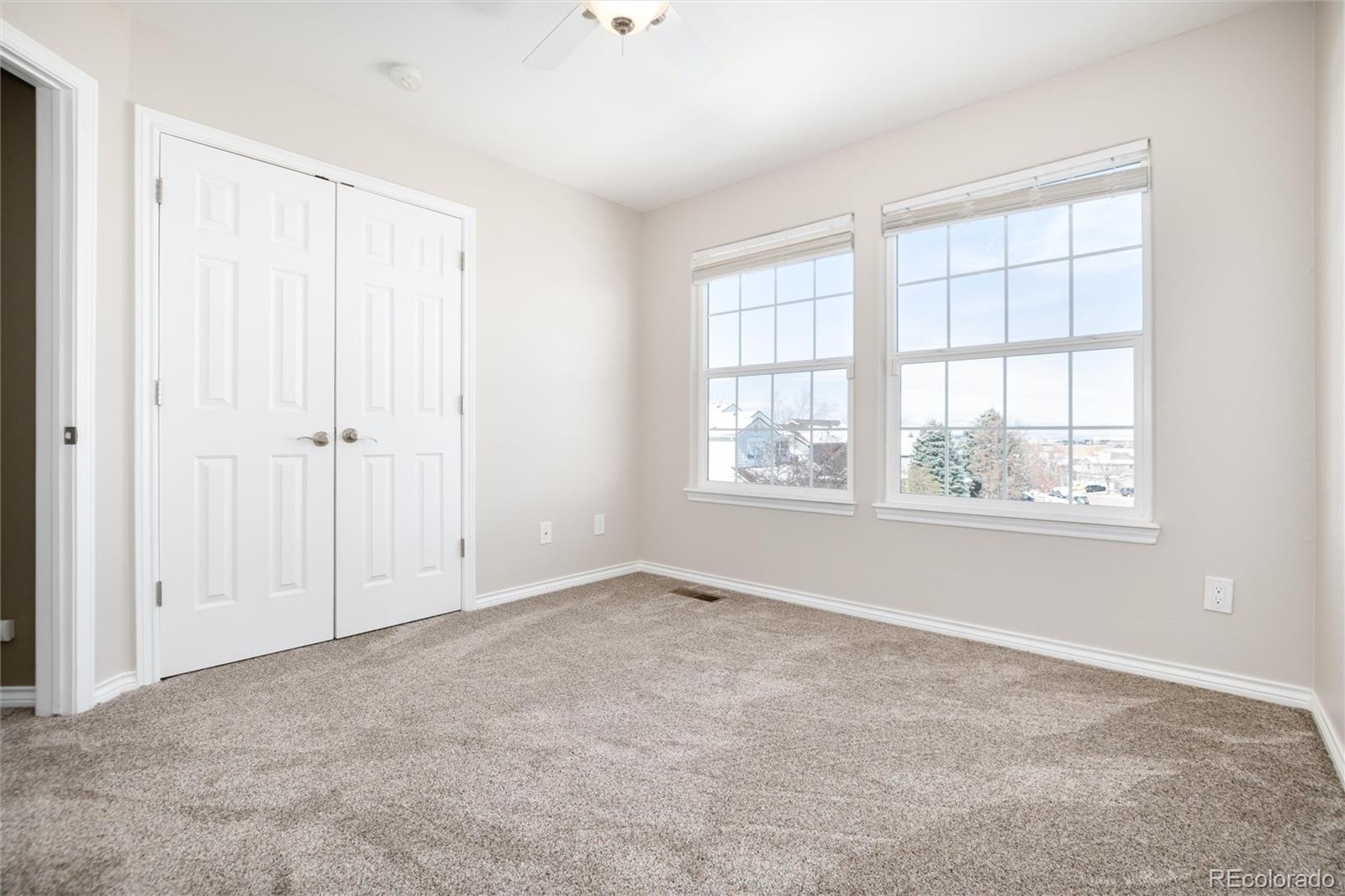 9486 South Autumn Ash Place Highlands Ranch, CO 80126 - Photo 34 of 50 an empty room with windows