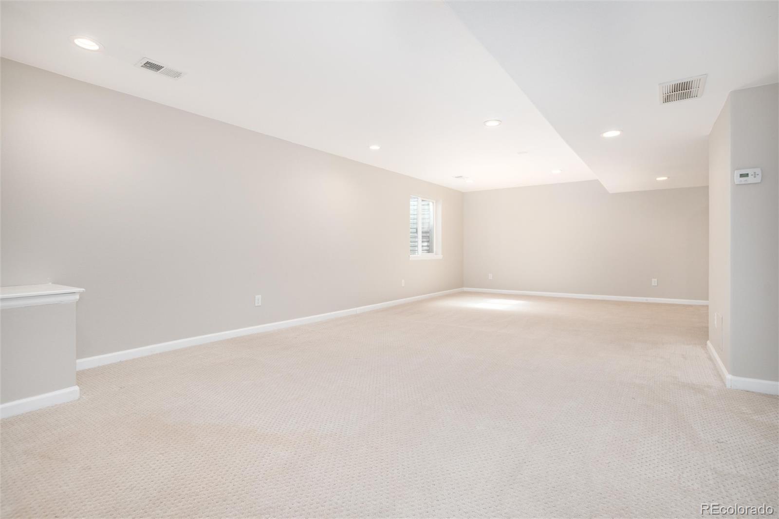 9486 South Autumn Ash Place Highlands Ranch, CO 80126 - Photo 42 of 50 an empty room with a empty space and windows