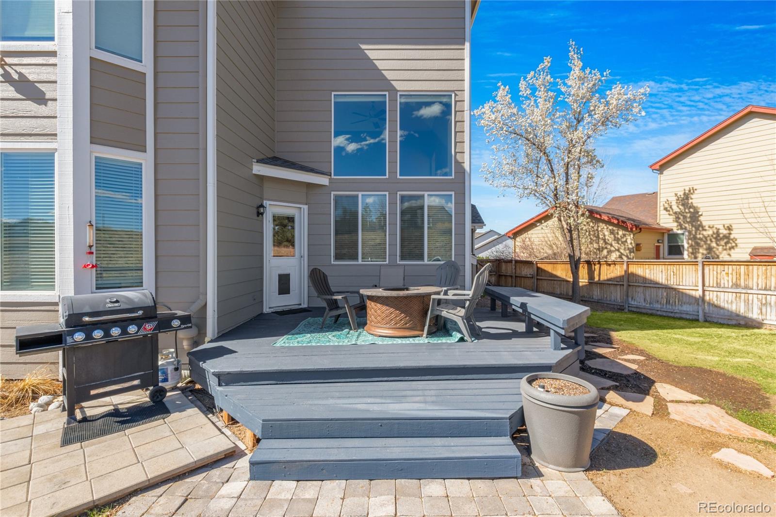 9486 South Autumn Ash Place Highlands Ranch, CO 80126 - Photo 44 of 50 a bench is sitting in front of a house