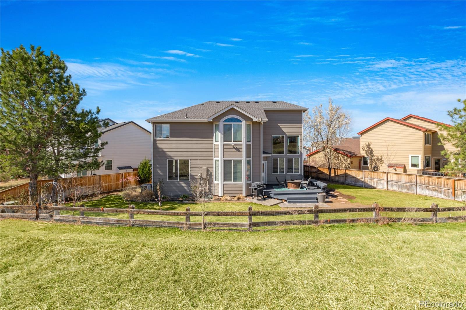 9486 South Autumn Ash Place Highlands Ranch, CO 80126 - Photo 47 of 50 a view of a house with a swimming pool