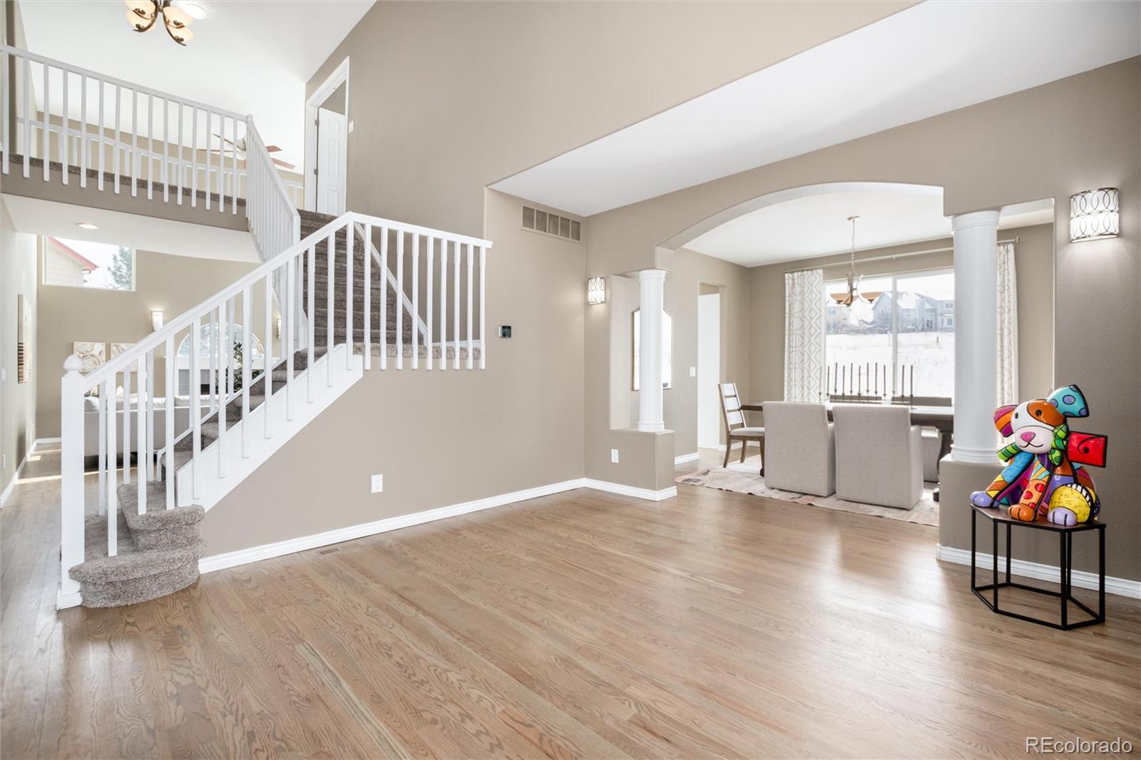 9486 South Autumn Ash Place Highlands Ranch, CO 80126 - Photo 6 of 50 a view of an empty room with wooden floor