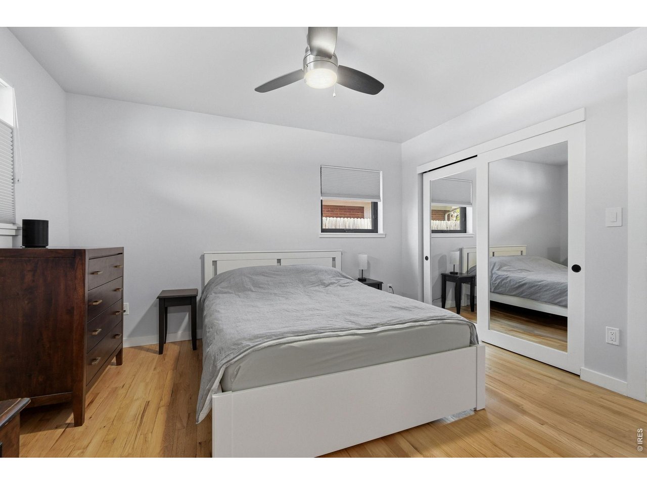 2910 19th Street Boulder, CO 80304 - Photo 12 of 28 a bedroom with a bed and a chandelier