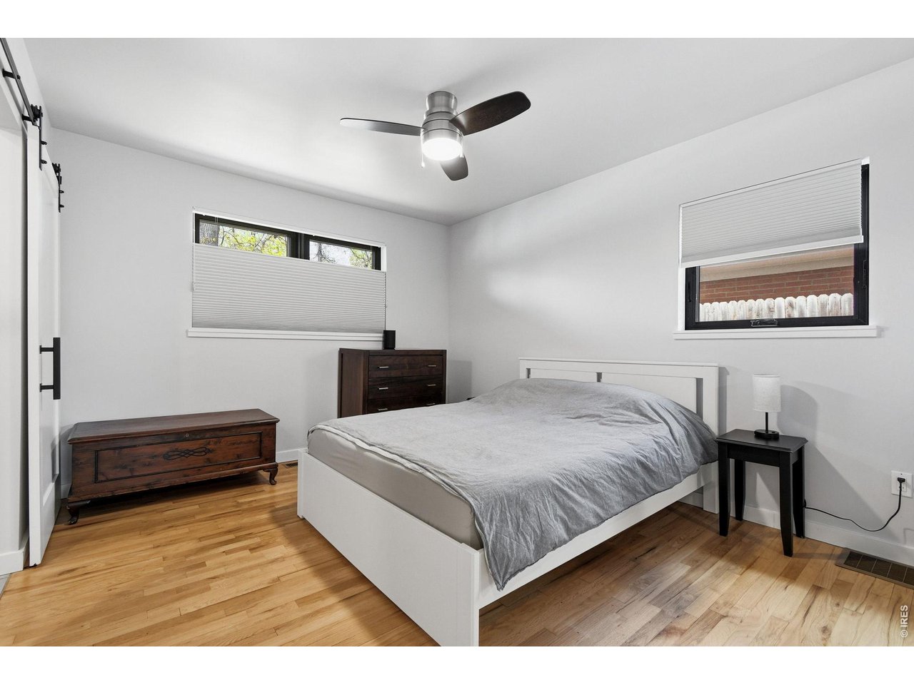 2910 19th Street Boulder, CO 80304 - Photo 14 of 28 a bedroom with a bed and a desk
