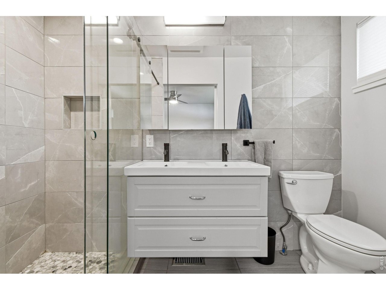 2910 19th Street Boulder, CO 80304 - Photo 16 of 28 a bathroom with a sink toilet and shower