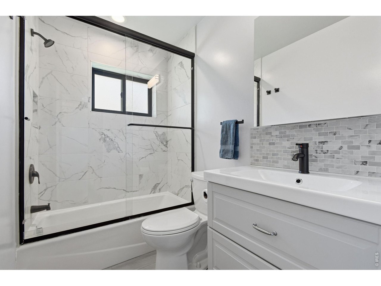 2910 19th Street Boulder, CO 80304 - Photo 20 of 28 a bathroom with a sink a toilet and shower