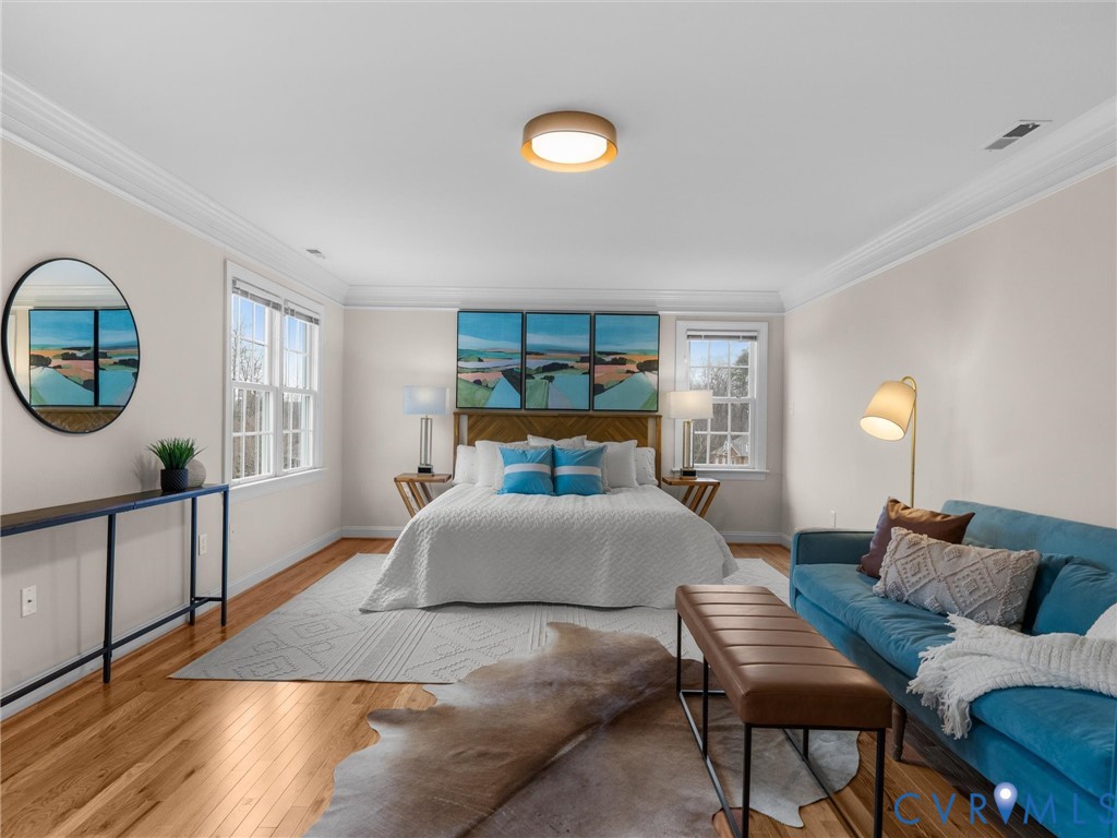 14335 Lander Road Midlothian, VA 23113 - Photo 37 of 70 a spacious bedroom with a bed a mirror and a large window