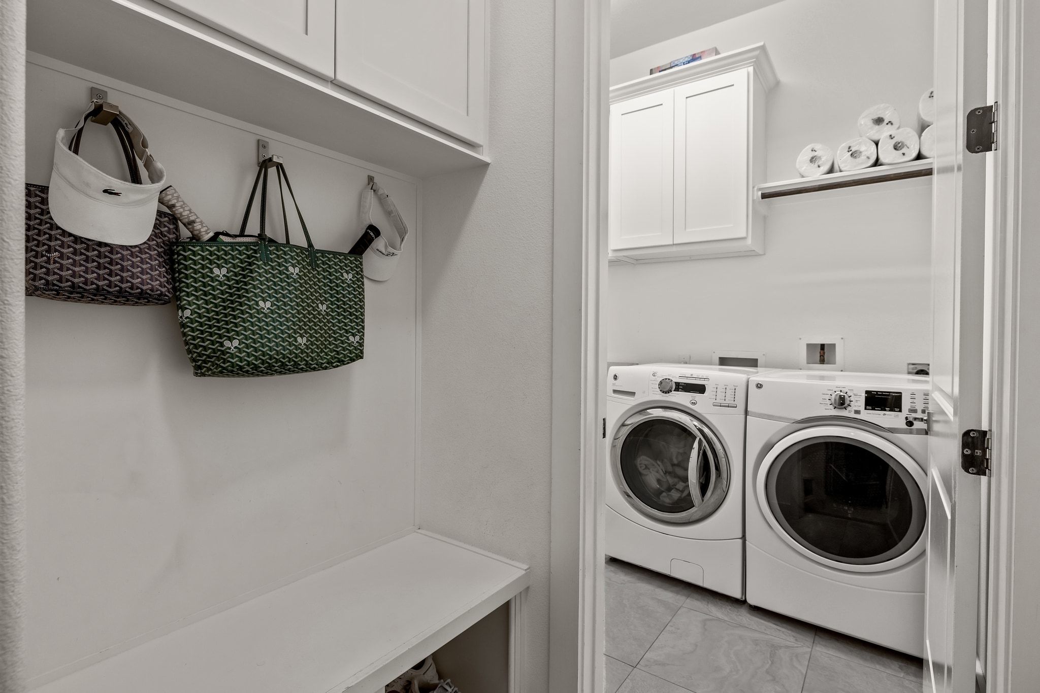 4720 Rockcliff Road, Unit 1 Austin, TX 78746 - Photo 38 of 39 Functional laundry room equipped with a washer and dryer, complemented by efficient built-in storage.