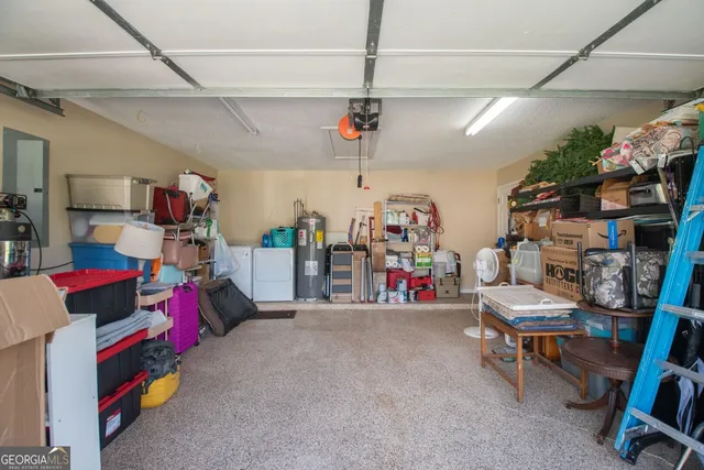 a kitchen with stainless steel appliances granite countertop a refrigerator a stove a sink and a microwave