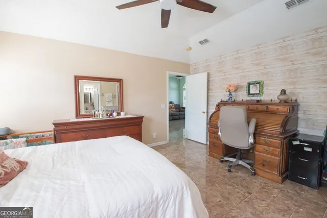 a bedroom with a bed and furniture