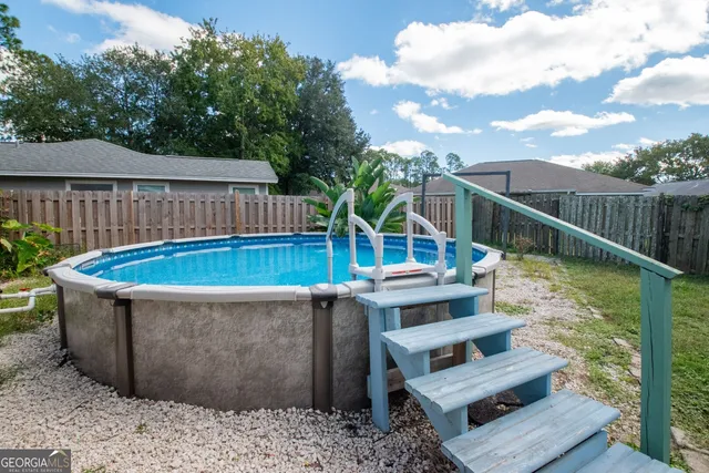 a view of a chairs and table on the deck