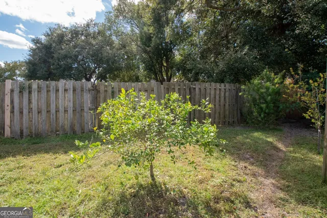 a garden with wooden fence