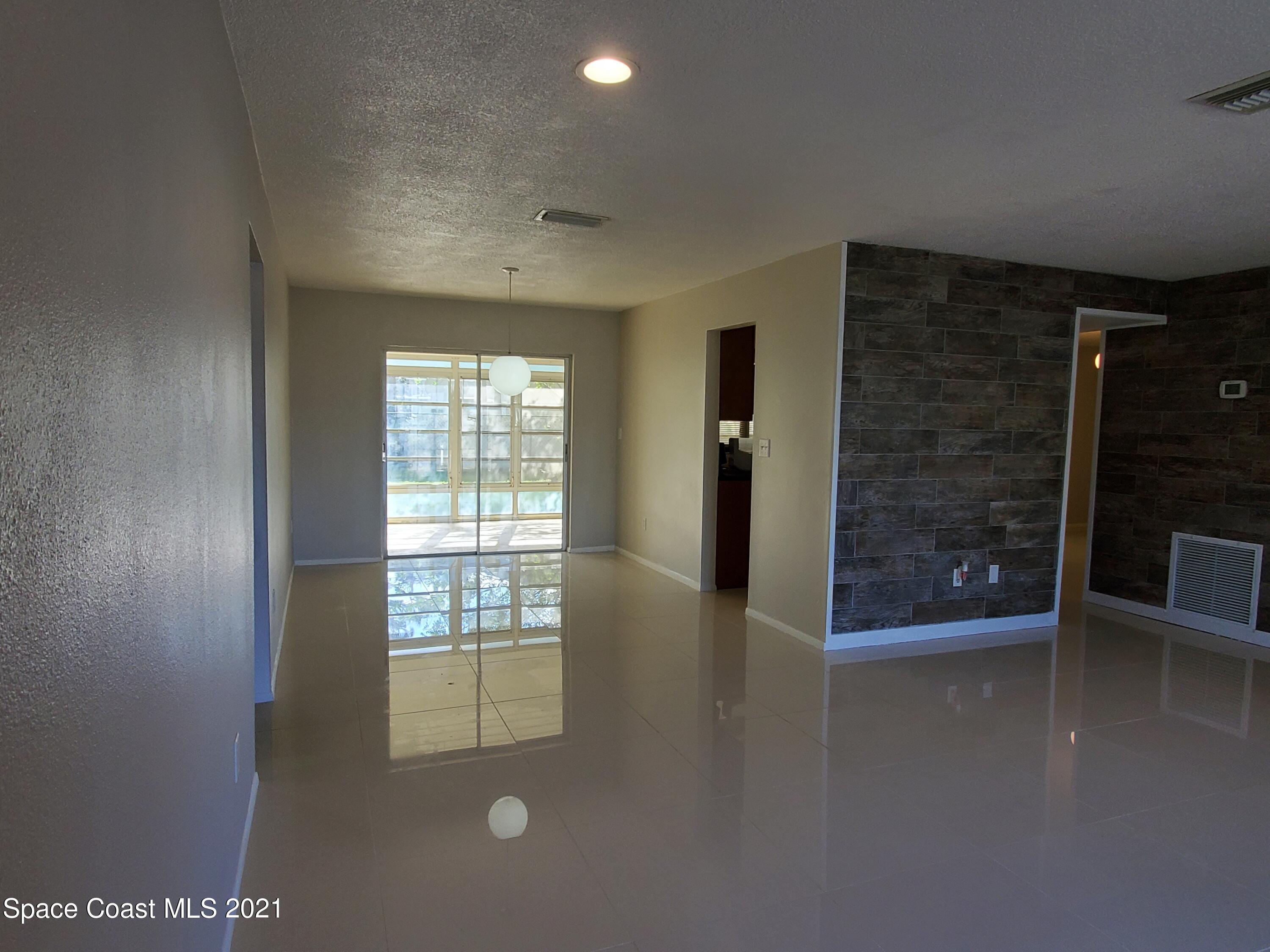 2740 Rhapsody Street Northeast Palm Bay, FL 32905 - Photo 11 of 78 Living Room