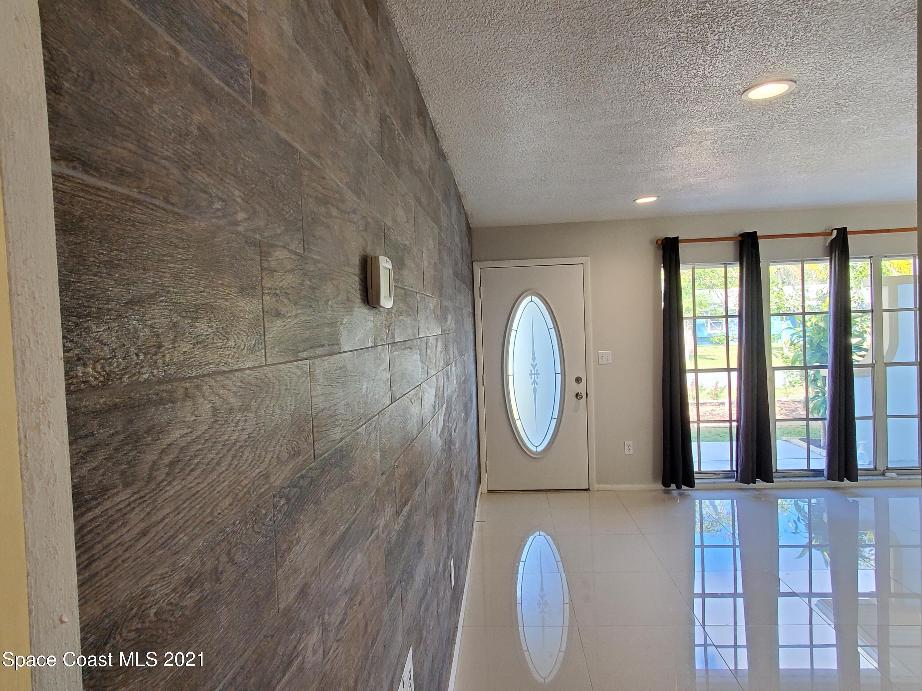 2740 Rhapsody Street Northeast Palm Bay, FL 32905 - Photo 13 of 78 Living Room