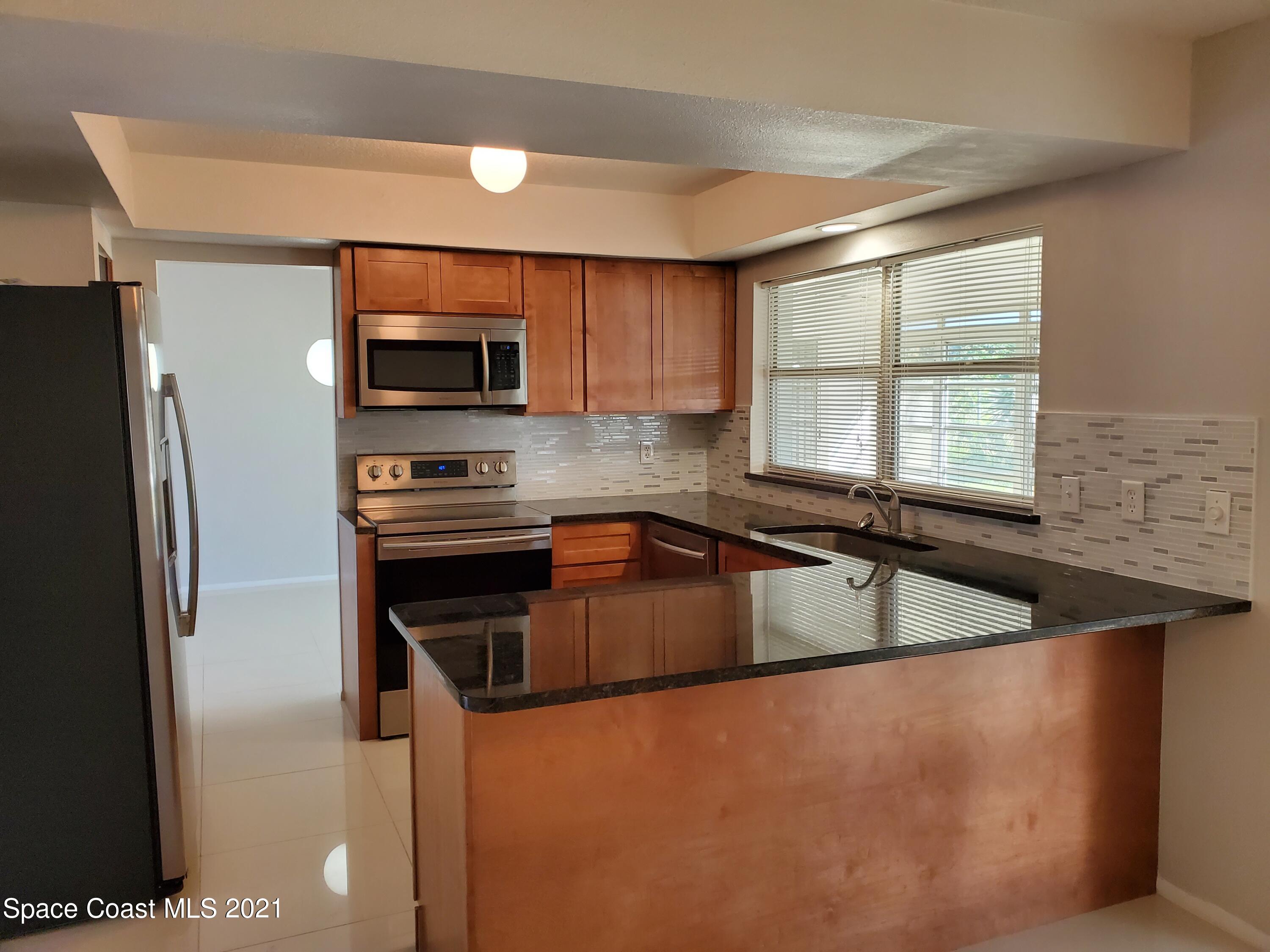2740 Rhapsody Street Northeast Palm Bay, FL 32905 - Photo 16 of 78 Kitchen