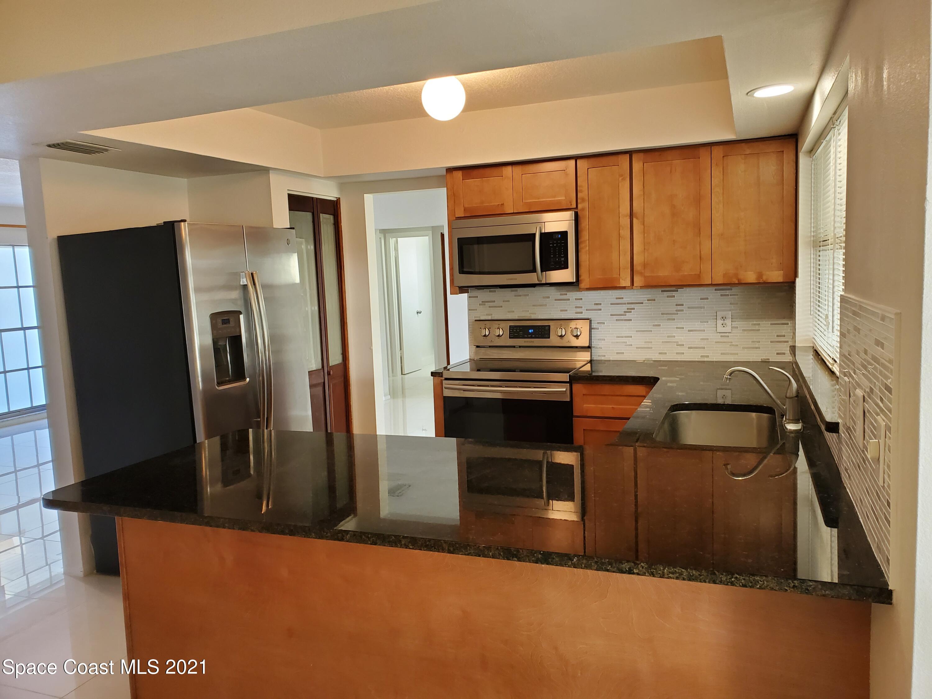 2740 Rhapsody Street Northeast Palm Bay, FL 32905 - Photo 17 of 78 Kitchen