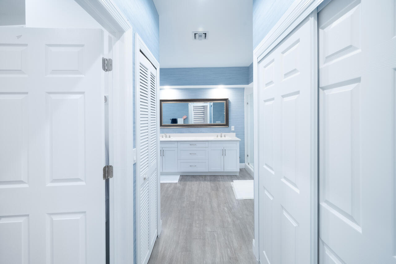 5809 Northwest 21st Way Boca Raton, FL 33496 - Photo 20 of 59 a bathroom with a sink and a mirror