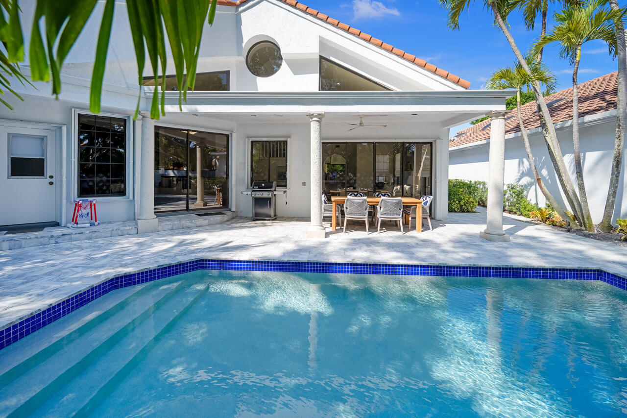 5809 Northwest 21st Way Boca Raton, FL 33496 - Photo 36 of 59 a view of pool with outdoor seating