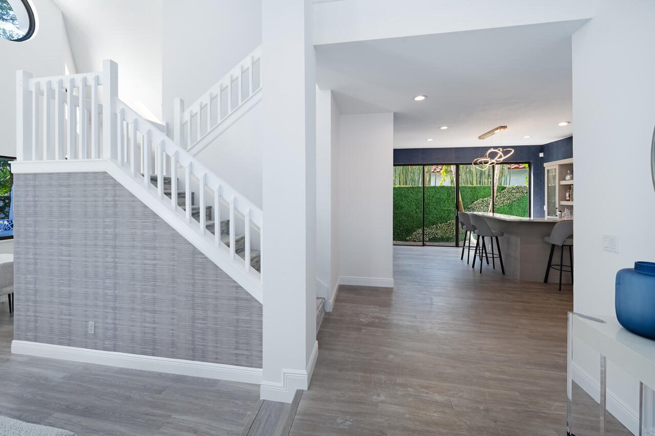 5809 Northwest 21st Way Boca Raton, FL 33496 - Photo 4 of 59 a view of entryway with wooden floor
