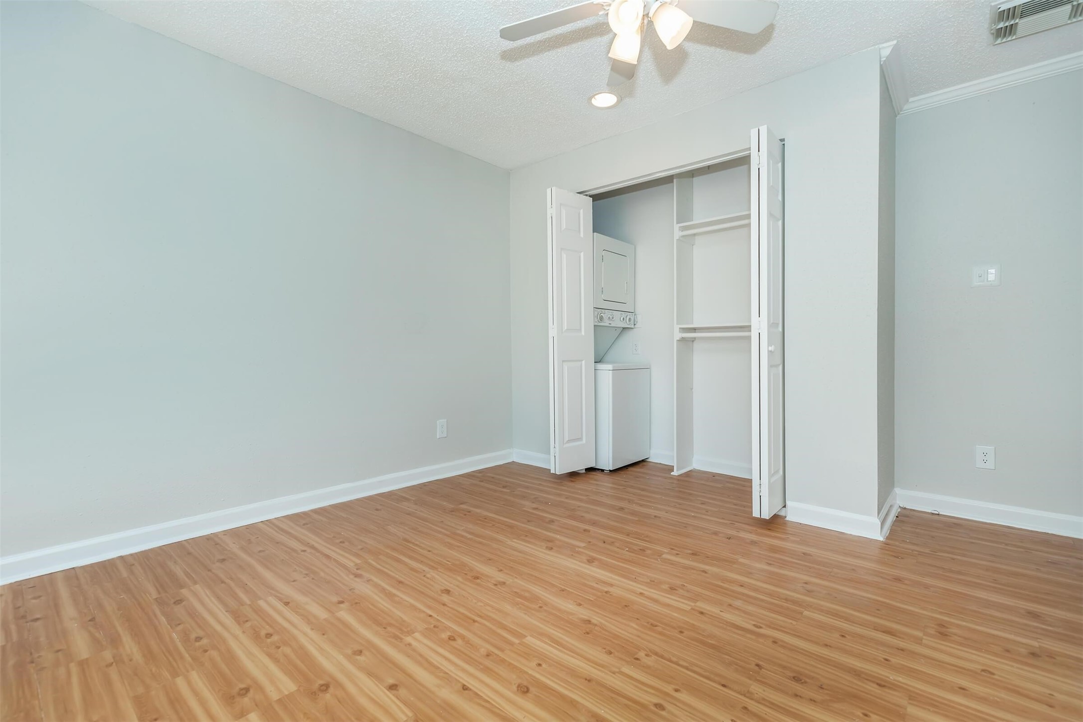 3001 Hillcroft Street, Unit G0605 Houston, TX 77057 - Photo 37 of 50 a view of an empty room with wooden floor