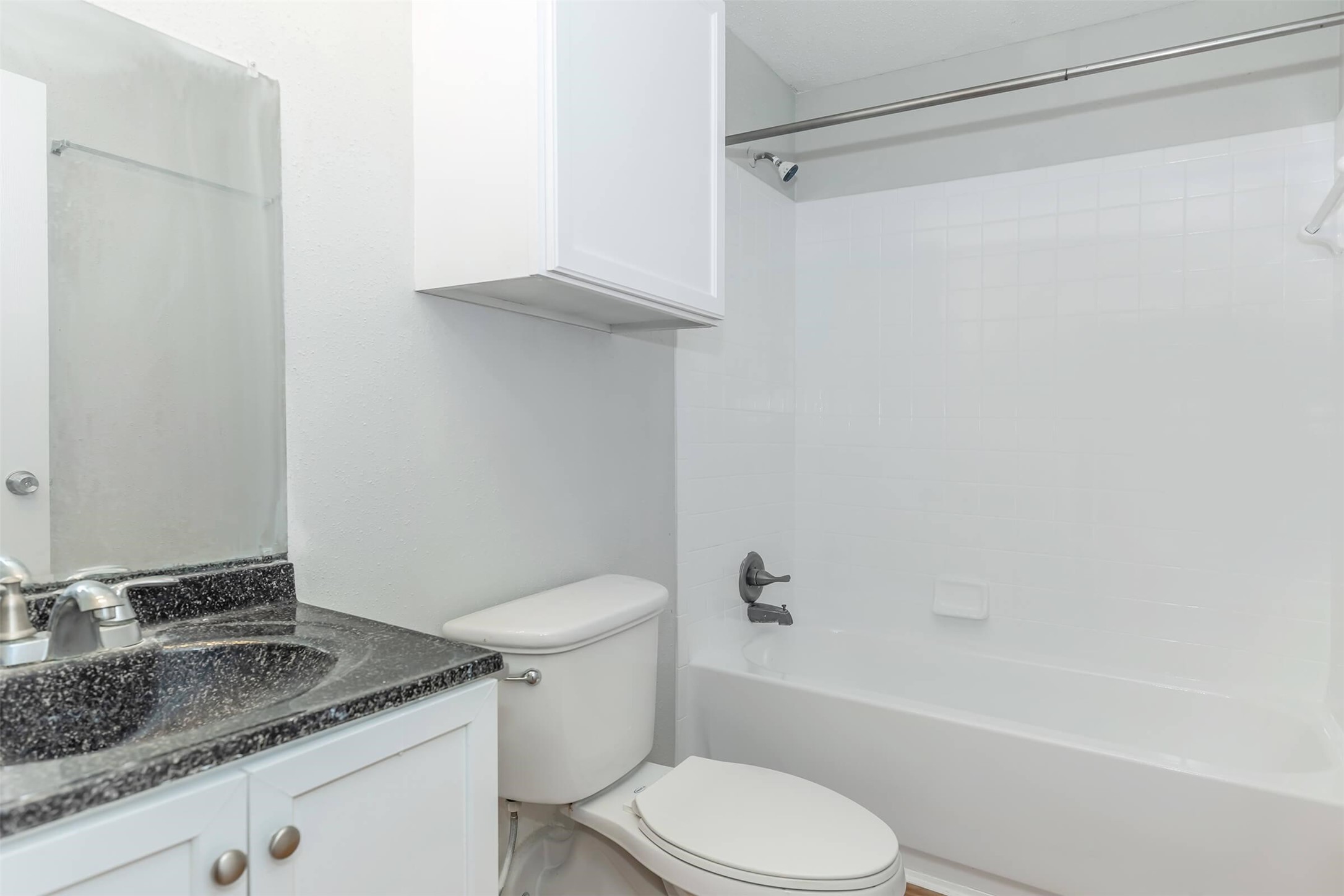 3001 Hillcroft Street, Unit G0605 Houston, TX 77057 - Photo 38 of 50 a white toilet sitting next to a bath tub