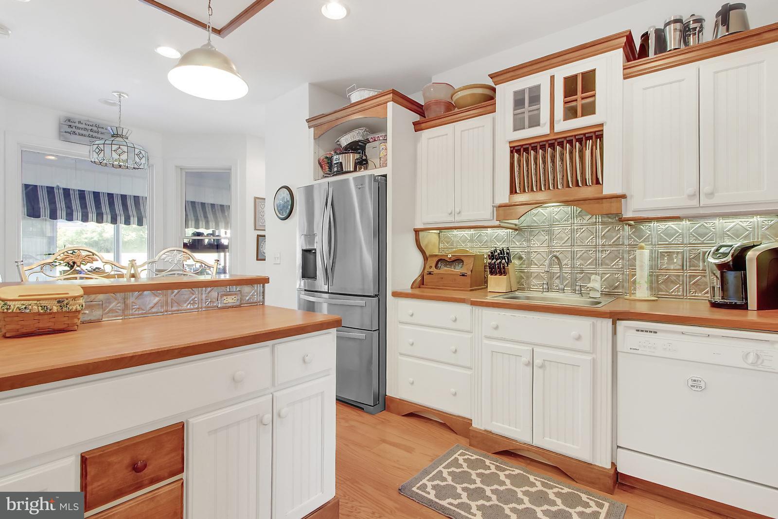 3129 Fairfield Road Gettysburg, PA 17325 - Photo 21 of 47 a kitchen with granite countertop a sink stove and cabinets