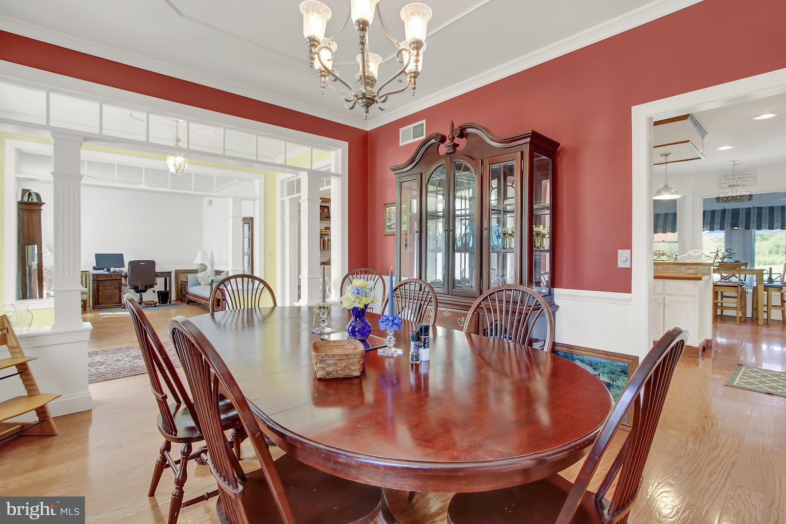 3129 Fairfield Road Gettysburg, PA 17325 - Photo 27 of 47 a dining room with furniture a chandelier and wooden floor