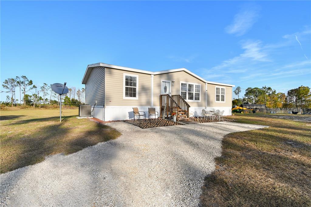 10989 Northwest Lily County Line Road Ona, FL 33865 - Photo 25 of 87 a view of a house with a big yard