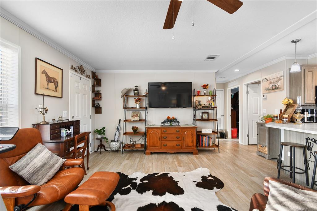 10989 Northwest Lily County Line Road Ona, FL 33865 - Photo 30 of 87 a living room with furniture and a flat screen tv