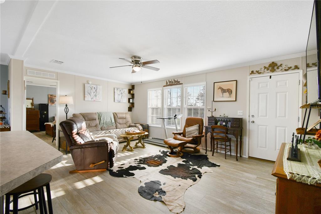 10989 Northwest Lily County Line Road Ona, FL 33865 - Photo 32 of 87 a living room with furniture or couch and a flat screen tv
