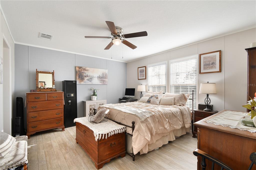 10989 Northwest Lily County Line Road Ona, FL 33865 - Photo 48 of 87 a bedroom with a bed and a dresser