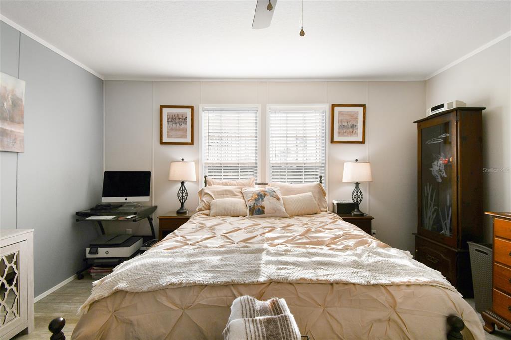 10989 Northwest Lily County Line Road Ona, FL 33865 - Photo 49 of 87 a bedroom with a bed and a flat screen tv