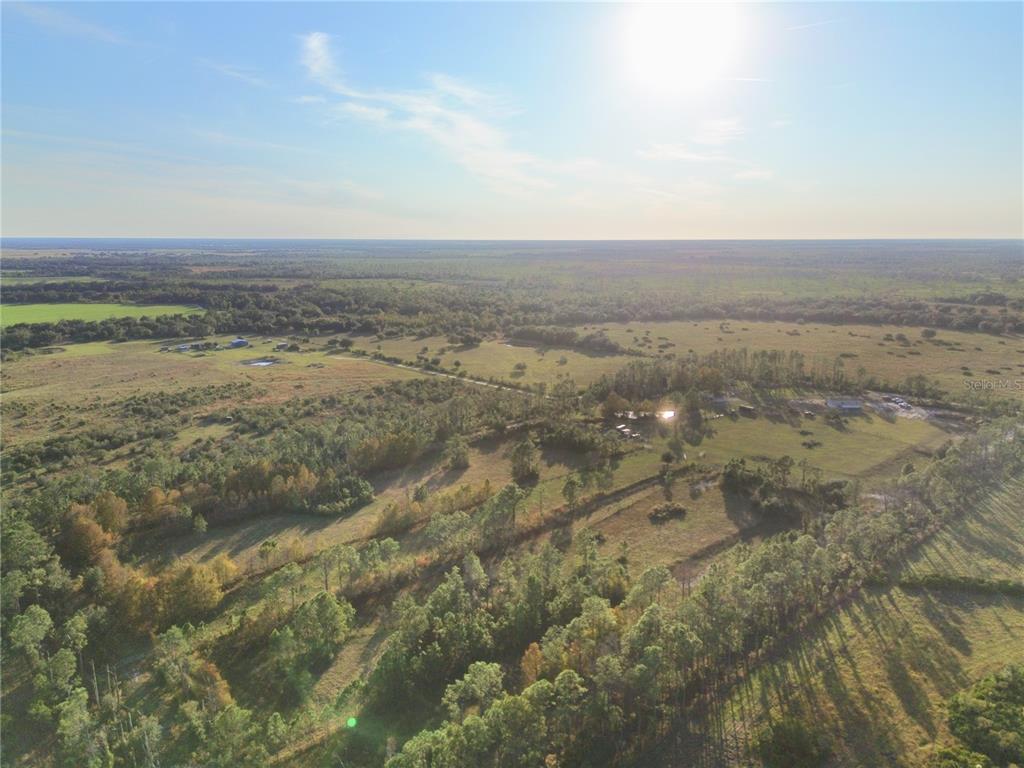 10989 Northwest Lily County Line Road Ona, FL 33865 - Photo 5 of 87 a view of an outdoor space and mountain view