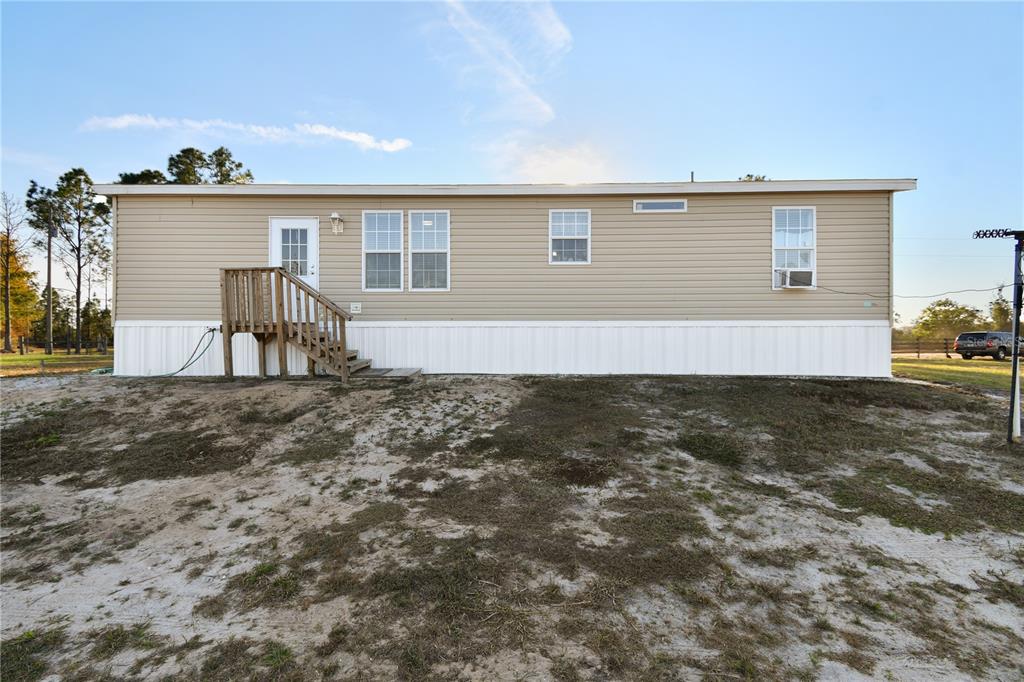 10989 Northwest Lily County Line Road Ona, FL 33865 - Photo 66 of 87 a view of a house with backyard and sitting area