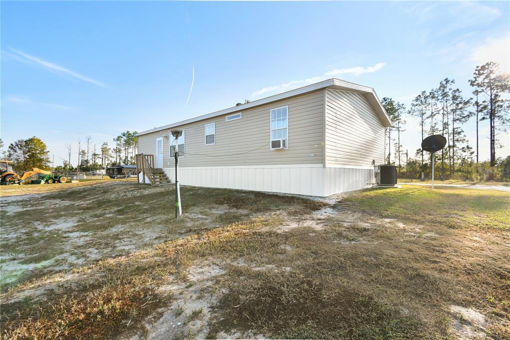 10989 Northwest Lily County Line Road Ona, FL 33865 - Photo 67 of 87 a view of a house with a yard