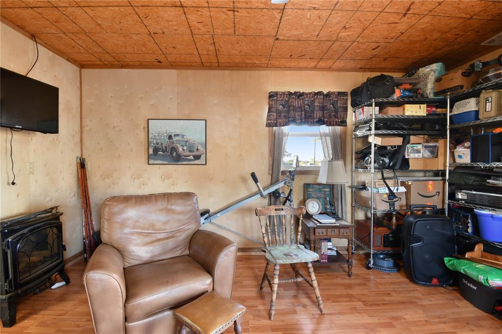 10989 Northwest Lily County Line Road Ona, FL 33865 - Photo 73 of 87 a view of a livingroom with furniture and a flat screen tv