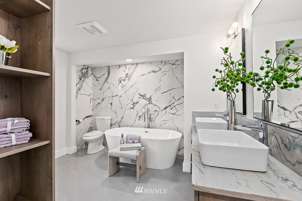 4906 Southwest Hinds Street Seattle, WA 98116 - Photo 11 of 40 a bath room with a toilet and a sink