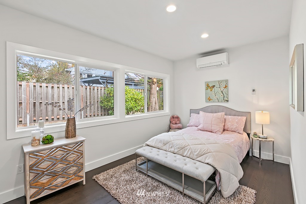 4906 Southwest Hinds Street Seattle, WA 98116 - Photo 16 of 40 a bedroom with a bed and a couch